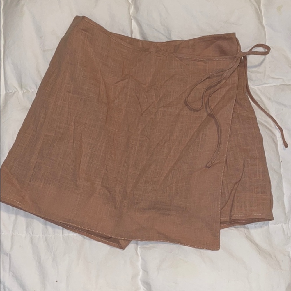 Beautiful mini wrap skirt with hidden shorts.